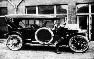 Our great-grandfather, Lester Blaushild, with the first car sold at his Ohio dealership in 1914.